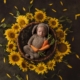 newborn image of baby girl in a bed of sunflowers